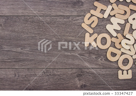 Wooden letters on wooden background 33347427