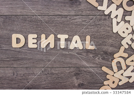 Word made with wooden letters next to a pile of Word made with wooden letters next to a pile of 33347584