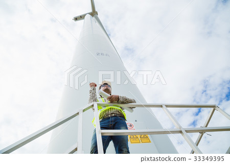 Engineer working at wind turbine site  33349395