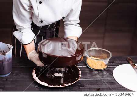 cake covered in chocolate. Mirror glaze 33349404