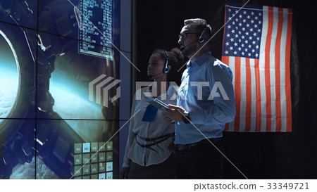 Scientists in flight control center Scientists in flight control center 33349721