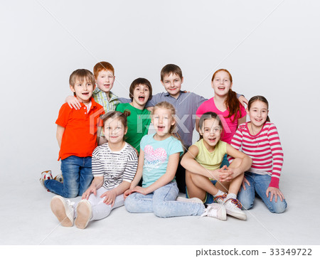 Happy kids sitting on floor at studio, copy space Happy kids sitting on floor at studio, copy space 33349722