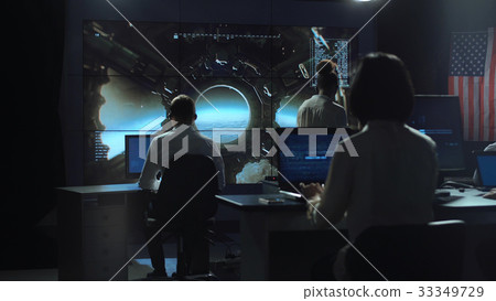 People working in mission control center People working in mission control center 33349729