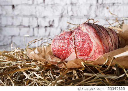 图库照片 raw aged prime black angus beef in craft papper on