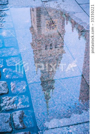 Reflection of City Hall Tower in a puddle. Hamburg Reflection of City Hall Tower in a puddle. Hamburg 33350221
