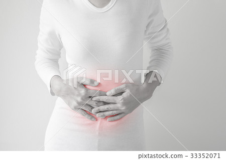 Woman stomachache on gray wall background. Woman stomachache on gray wall background. 33352071
