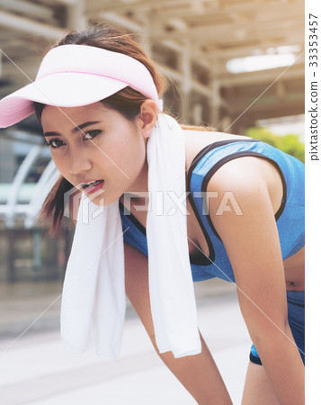 Exhausted woman runner taking breath Exhausted woman runner taking breath 33353457
