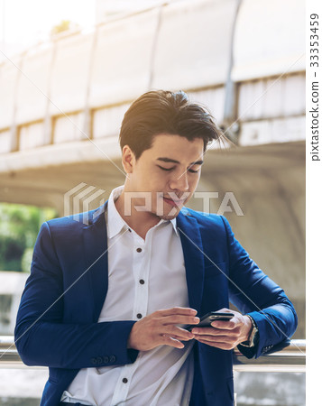 Business man using smartphone Business man using smartphone 33353459