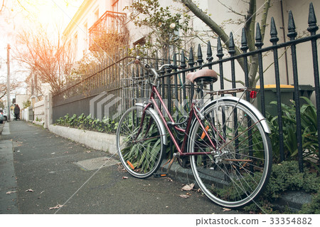 classic bicycle at the town with lens flare. classic bicycle at the town with lens flare. 33354882