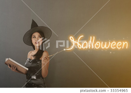 Beautiful asian witch woman with magic wand 33354965