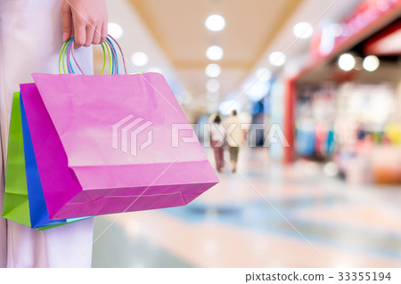 Woman with shopping bags. 33355194