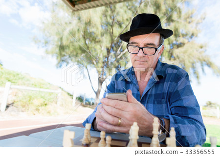 Old man with his mobile 33356555