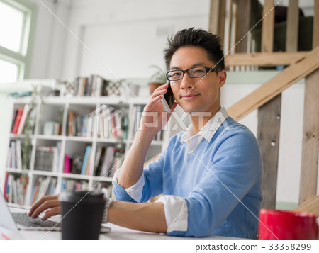 Portrait of young businessman with mobile 33358299