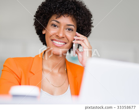 Portrait of young businesswoman with mobile 33358677