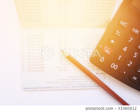Calculator and passbook on white background Calculator and passbook on white background 33360812