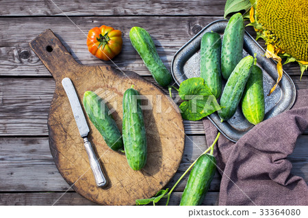 Cucumbers and knife top view 33364080