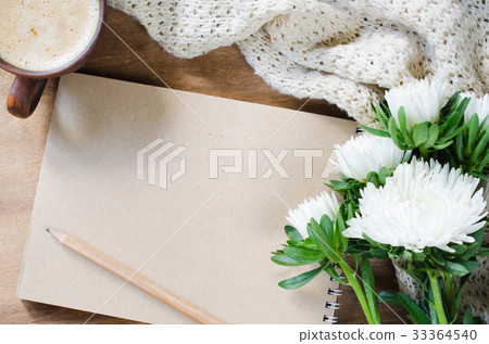 Blank brown notebook with autumn flowers. Blank brown notebook with autumn flowers. 33364540