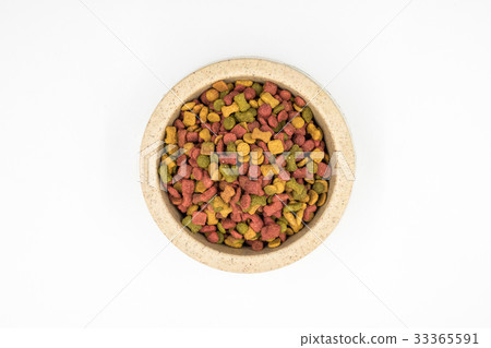 Dog food in a bowl on white background. 33365591