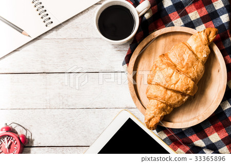 croissant with coffee, tablet and notebook croissant with coffee, tablet and notebook 33365896