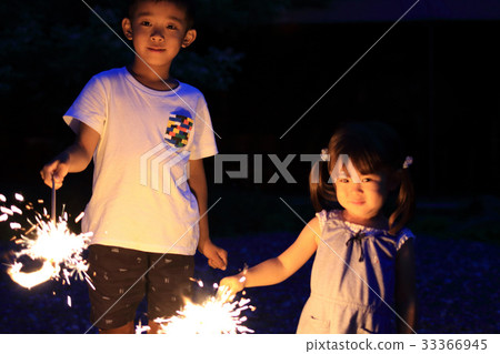 Brother and sister doing fireworks (7 years old and 2 years old) 33366945