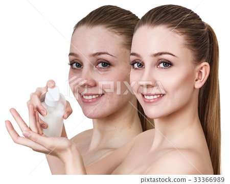 Young woman holding jar of cream. 33366989
