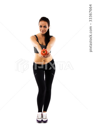 Slim girl wearing training suit offering a tomato Slim girl wearing training suit offering a tomato 33367664