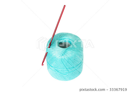 Turquoise thread clew with crochet hook isolated Turquoise thread clew with crochet hook isolated 33367919