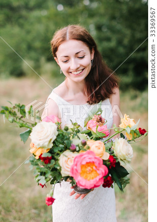bouquet, people and floral arrangement concept - bouquet, people and floral arrangement concept - 33369567