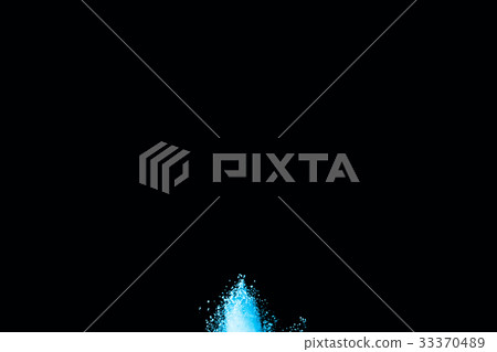 Abstract blue powder splatted on white background. Abstract blue powder splatted on white background. 33370489