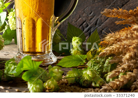 Detail of Beer Glass with Hops and Barley Detail of Beer Glass with Hops and Barley 33371240