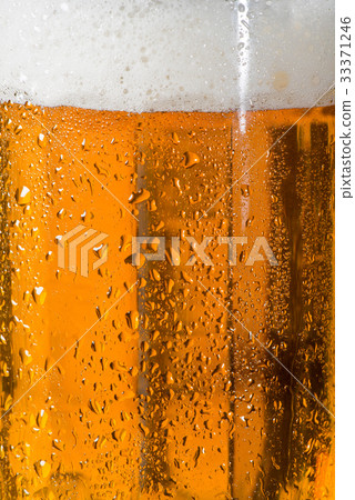 Detail of Beer Glass with Drops of Water 33371246
