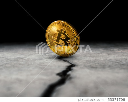 golden bitcoin coin on cracked concrete floor  33371706