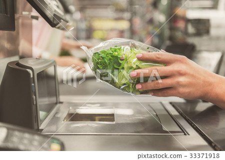 Adult cashier lady working in supermarket 33371918