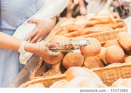 Adult consumer taking small bap Adult consumer taking small bap 33371960