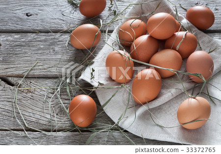 Fresh chicken brown eggs on rustic wood, organic Fresh chicken brown eggs on rustic wood, organic 33372765
