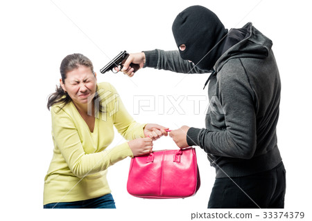 A dangerous armed robber steals a bag from a woman A dangerous armed robber steals a bag from a woman 33374379