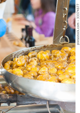 New potatoes fried in a pan with Italian recipe 33374877