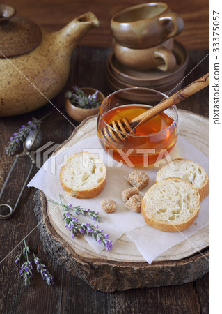 Lavender honey, flowering lavender and baguette 33375057