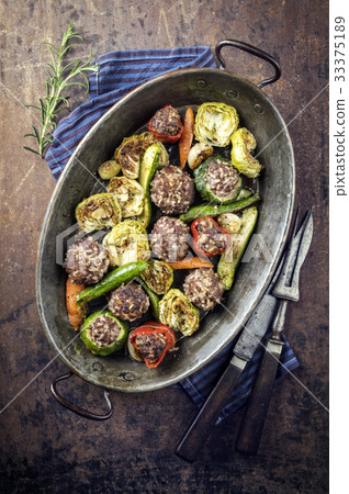 Rice Meatballs with Vegetable in Copper Pod 33375189