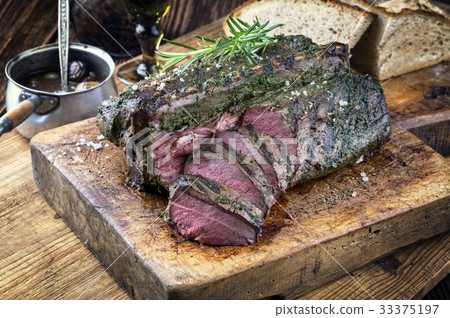 Barbecue Saddle of Venison on Cutting Board Barbecue Saddle of Venison on Cutting Board 33375197
