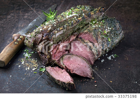 Barbecue Saddle of Venison on Cutting Board 33375198