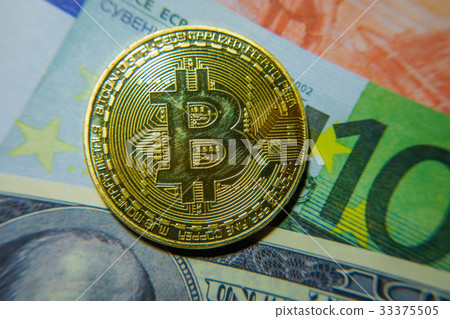 Golden bitcoin coin on the one hundred dollars 33375505