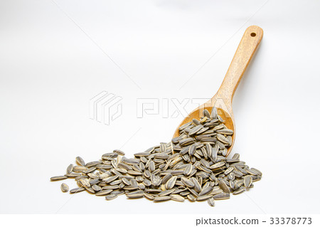 Dried sunflower seeds in the wooden spoon 33378773