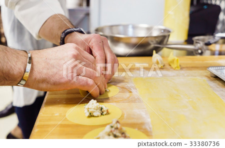 chef making ravioli 33380736