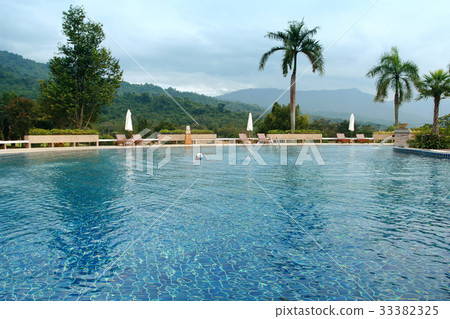 Young girl in the blue water pool, Thailand 33382325