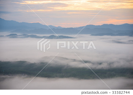 Landscape of misty mountain forest covered hills  33382744