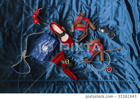 Female accessories on blue background 33382843