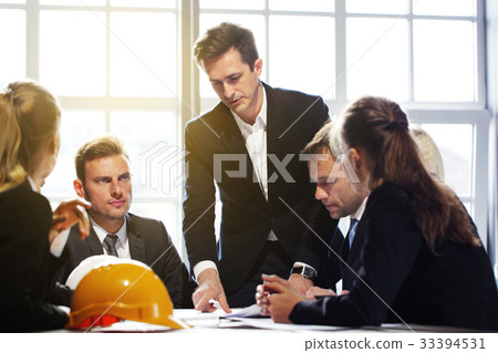 Business people with construction blueprint 33394531
