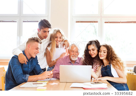 High school student with microscopes in laboratory 33395682