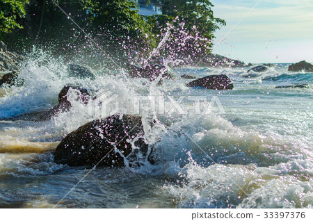 Wave splash in the sea against stone Wave splash in the sea against stone 33397376